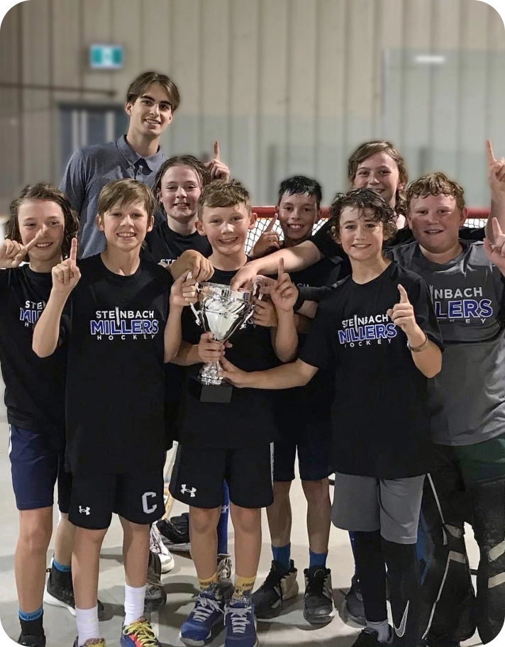 Steinbach Millers Hockey Team holding a trophy