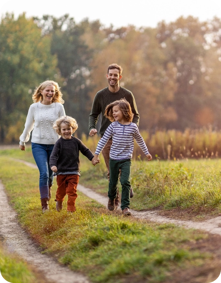 Family walking down a nature path